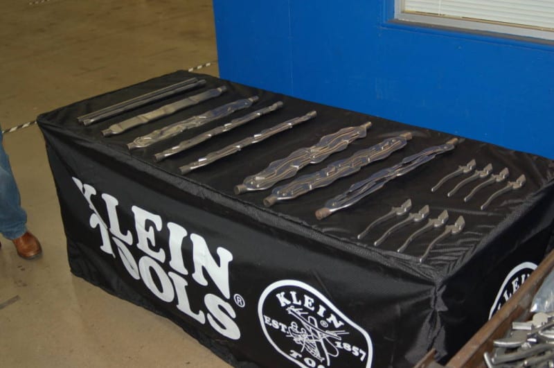 The stages of creating opposite sides of pliers from a steel rod. 