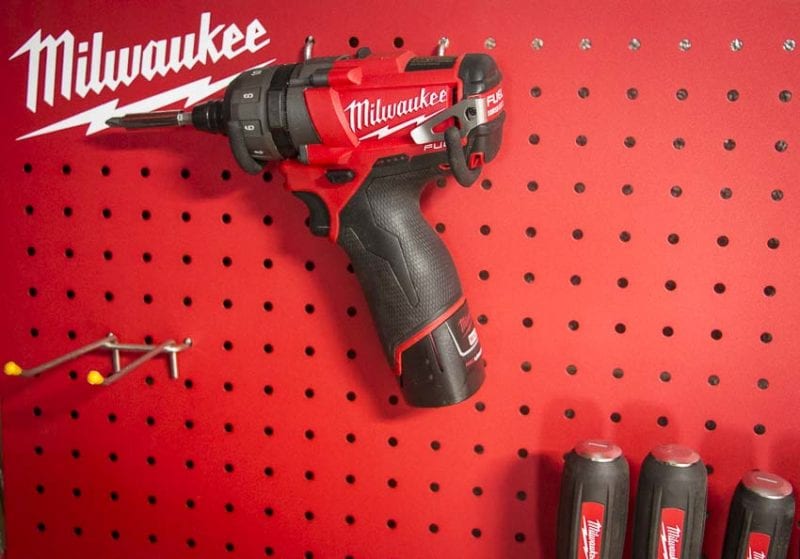 M12 screwdriver hanging on the steel pegboard